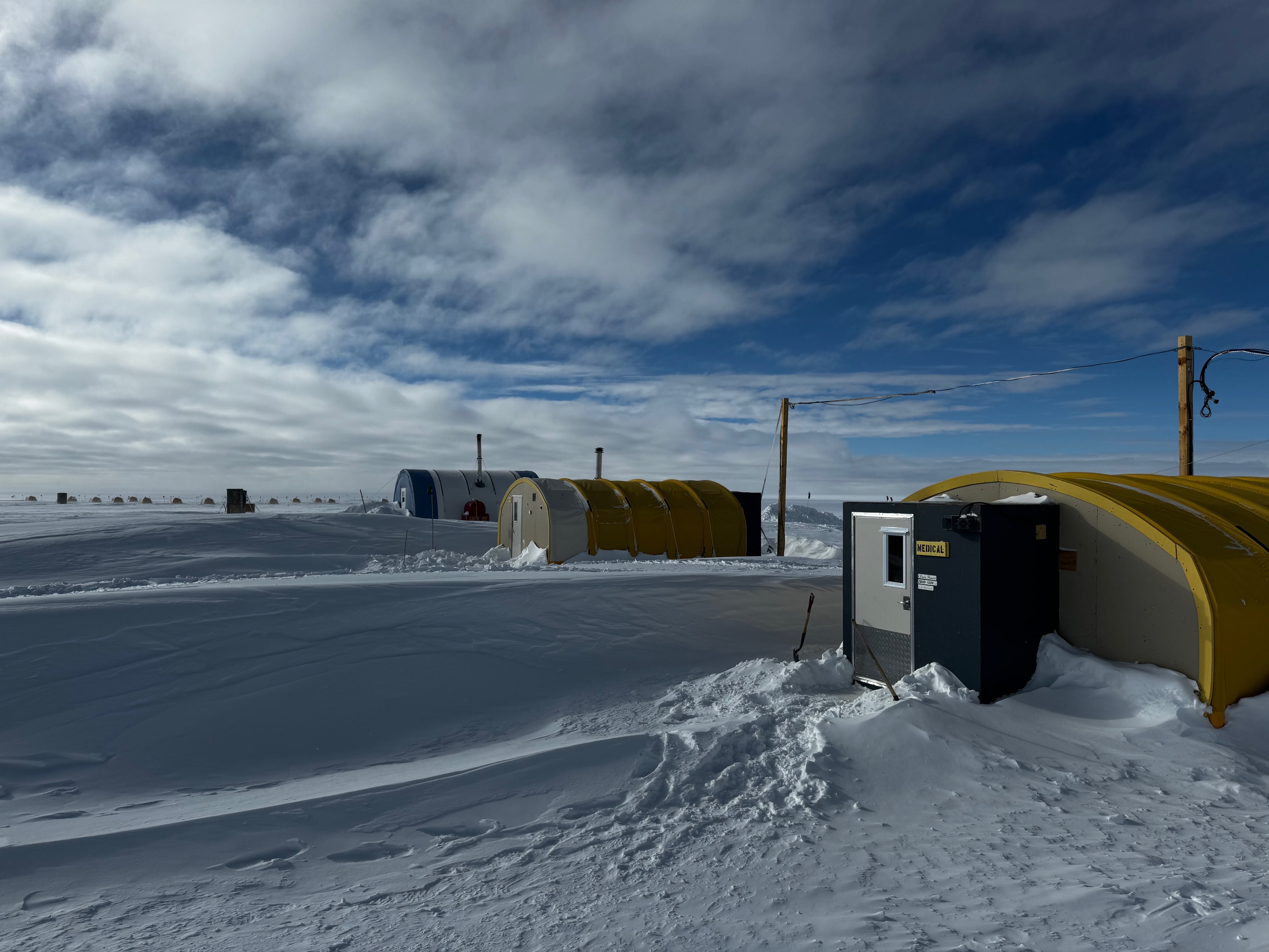 The medical tent and Jamesway shelters at WAIS Divide deep field camp, Antarctica, with a marked MEDICAL hut in the foreground.